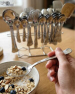 The premium 53-piece stainless steel cutlery collection featured in 6.jpg, displayed neatly on a wooden table to highlight the polished finish and design.