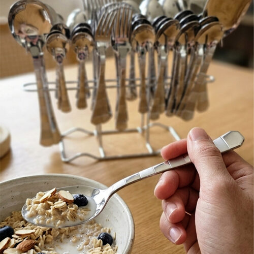 The premium 53-piece stainless steel cutlery collection featured in 6.jpg, displayed neatly on a wooden table to highlight the polished finish and design.