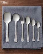 A high-quality 37-piece stainless steel cutlery set arranged neatly, including various spoons, forks, and knives, as displayed in 7.jpg.