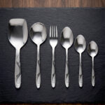 Elevate your dining table with this complete 53-piece cutlery set, expertly crafted to combine durability with timeless elegance. Made from high-quality stainless steel, this set is designed to resist tarnish and rust, ensuring your utensils maintain their shine for years to come. Whether you are hosting a formal dinner or upgrading your daily dining experience, this versatile set provides everything you need for service, organization, and style. Key Features Comprehensive 53-Piece Set: Includes everything required for a full table setting, neatly organized with an included stand for convenient storage and display. Premium Quality Material: Crafted from durable, corrosion-resistant stainless steel. Proudly Made in Pakistan: Supports local craftsmanship with high-grade manufacturing standards. Versatile Collection: Designed to handle every course, from soups and rice to main entrees. Set Breakdown: 12 x Table Spoons 12 x Tea Spoons 12 x Forks 12 x Knives 2 x Rice Serving Spoons 2 x Soup Serving Spoons 1 x Cutlery Stand