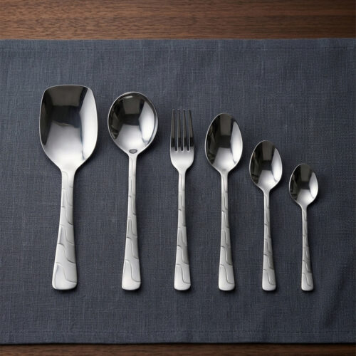 A high-quality 53-piece stainless steel cutlery set featuring elegant patterned handles, displayed on a grey fabric surface as shown in 9.jpg.