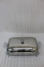 One More 3-liter premium stainless steel rectangular chafing dish with ornate legs and dual buffet burners on a luxury dining table setup.