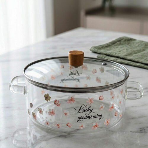 Alt Text: One More 2.5L square glass pot with floral prints, clear glass lid, and a wooden knob resting on a marble countertop.