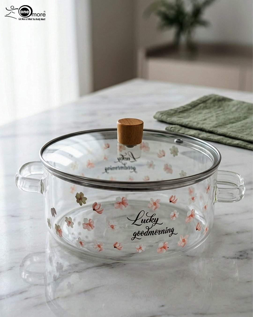 1 Alt Text: One More 2.5L square glass pot with floral prints, clear glass lid, and a wooden knob resting on a marble countertop.