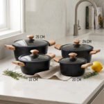 Set of four premium Turkish diamond-infused non-stick pots in sizes 20cm, 22cm, 24cm, and 26cm displayed on a kitchen counter, available at OneMore Pakistan.