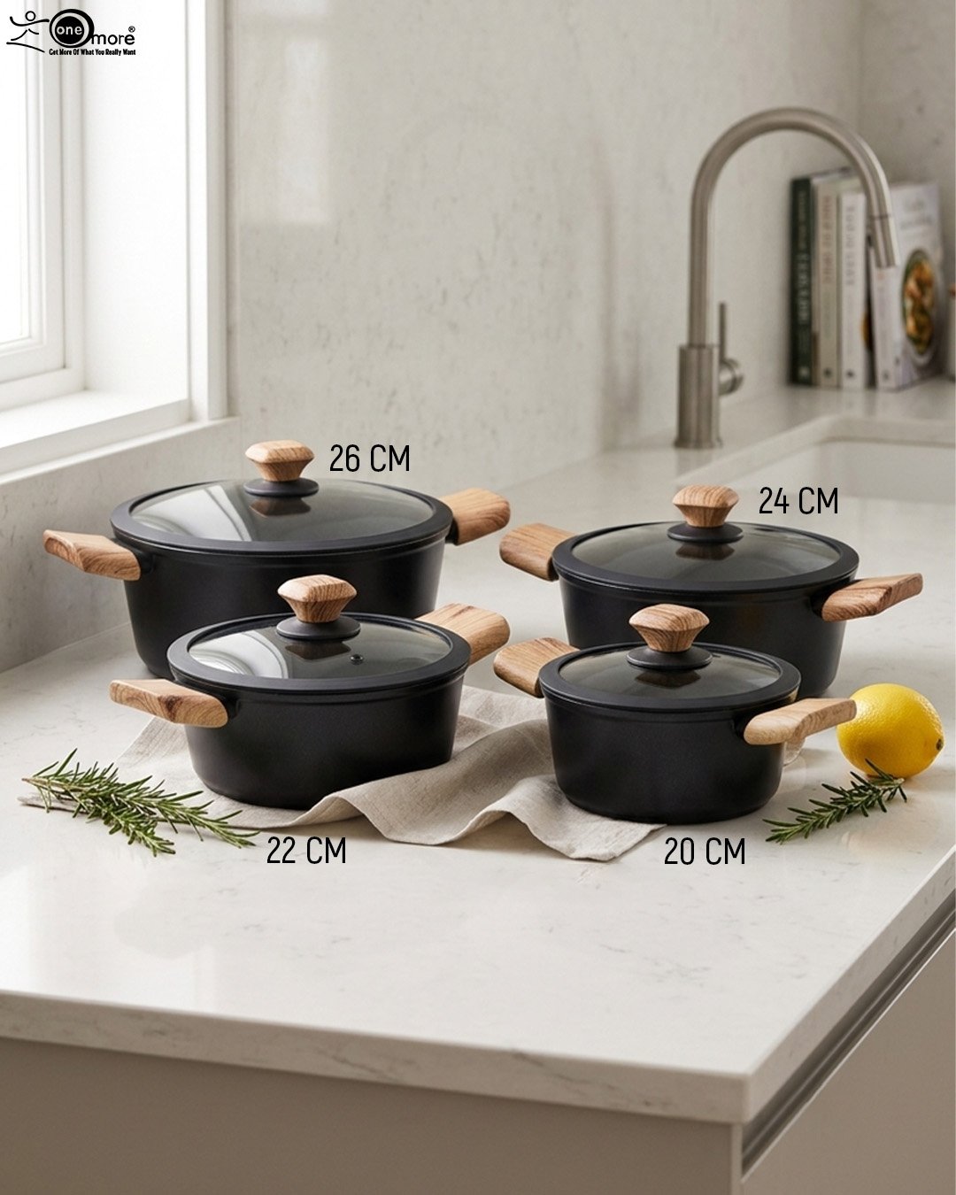 1 Set of four premium Turkish diamond-infused non-stick pots in sizes 20cm, 22cm, 24cm, and 26cm displayed on a kitchen counter, available at OneMore Pakistan.