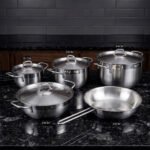 A set of premium Made in Turkey non-stick steel pots and pans in various sizes ranging from 16cm to 24cm, displayed on a kitchen counter at OneMore.