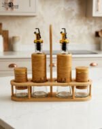 2.jpg shows a modern kitchen organizer set including two glass oil bottles with pourers and two salt/spice shakers, all encased in bamboo wood accents and held in a matching wooden stand.