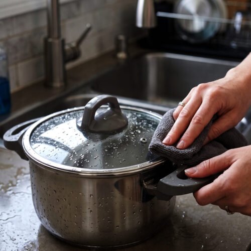 Turkish 2-in-1 non-stick steel cooker set featuring a 7L pressure pot and a 4L cooking pot with interchangeable lids, displayed on a kitchen counter.