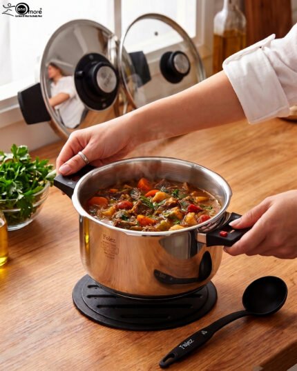 Falez 6L non-stick stainless steel 6-piece cooker set featuring a pot, lid, two spoons, and a heat-resistant table pad on a countertop.
