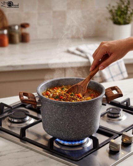 6L Turkish non-stick granite cooker with wood-finish handles and lid, showcased in a modern kitchen setting at OneMore.