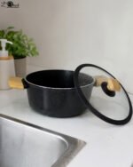 Set of four premium Turkish diamond-infused non-stick pots in sizes 20cm, 22cm, 24cm, and 26cm displayed on a kitchen counter, available at OneMore Pakistan.