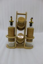 A stylish set of two glass oil dispensers and two salt shakers housed in a bamboo wooden stand, as seen in 1.jpg.