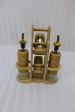 A stylish set of two glass oil dispensers and two salt shakers housed in a bamboo wooden stand, as seen in 1.jpg.