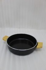Two black, Made-in-Turkey granite non-stick casserole pots (26cm and 30cm) with wooden-look handles and rubber-rimmed lids sitting on a marble kitchen countertop.