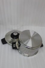 Falez 6L non-stick stainless steel 6-piece cooker set featuring a pot, lid, two spoons, and a heat-resistant table pad on a countertop.