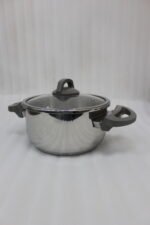 Turkish 2-in-1 non-stick steel cooker set featuring a 7L pressure pot and a 4L cooking pot with interchangeable lids, displayed on a kitchen counter.