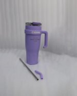 : An array of colorful 1.2L stainless steel tumblers with handles and clear lids displayed on a kitchen counter