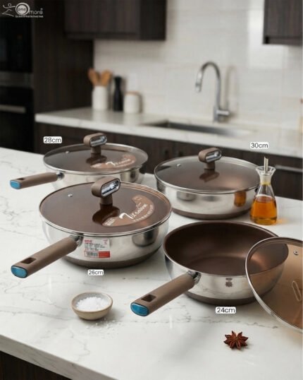A collection of high-quality titanium stainless steel woks and frying pans in sizes 24cm, 26cm, 28cm, and 30cm with glass lids and ergonomic handles displayed on a kitchen counter.