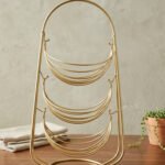 3-tier gold wire decorative metal baskets stand on a wooden table