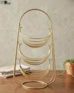 3-tier gold wire decorative metal baskets stand on a wooden table