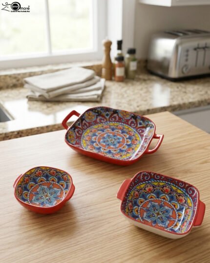Three vibrant red Moroccan Marrakech decorative ceramic bowls with handles set on a wooden countertop