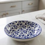 8-inch ceramic decorative Marakesh bowl with intricate blue and white floral pattern resting on a white countertop