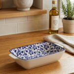 9-inch decorative Marrakech blue and white floral ceramic rectangular serving dish with handles on a wooden kitchen counter