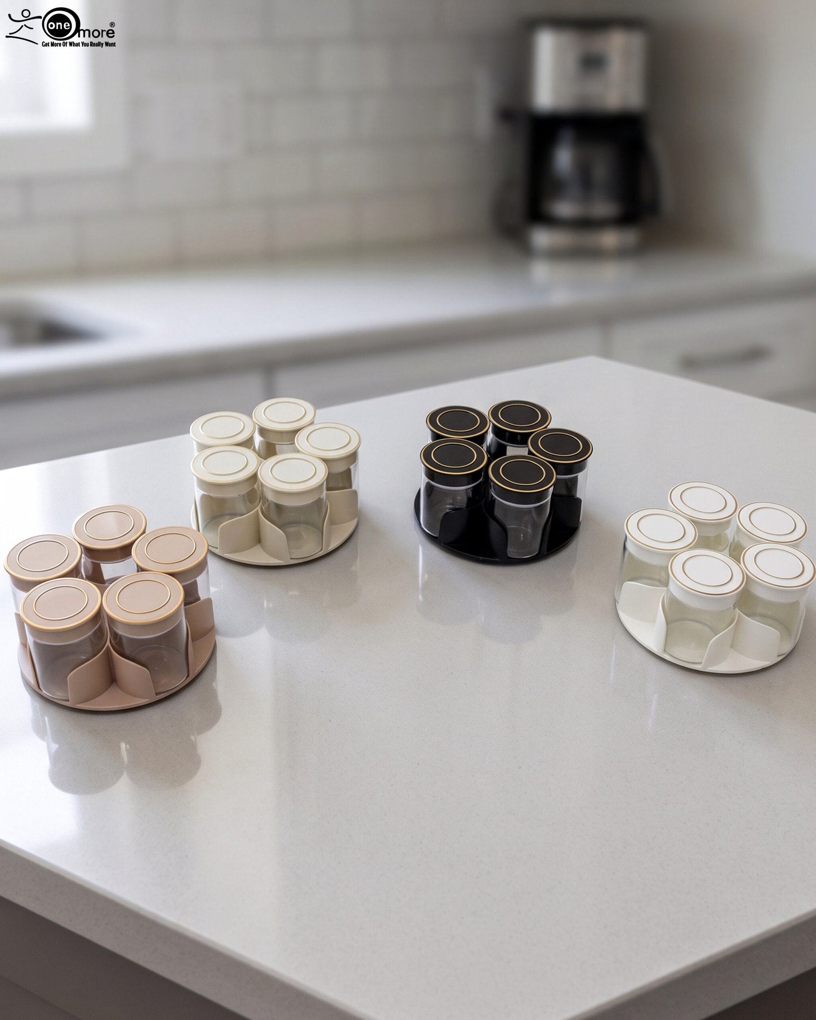 1 Four modern 6-piece revolving glass spice jar sets with gold trim lids displayed on a white kitchen countertop in beige, cream, black, and white colors.