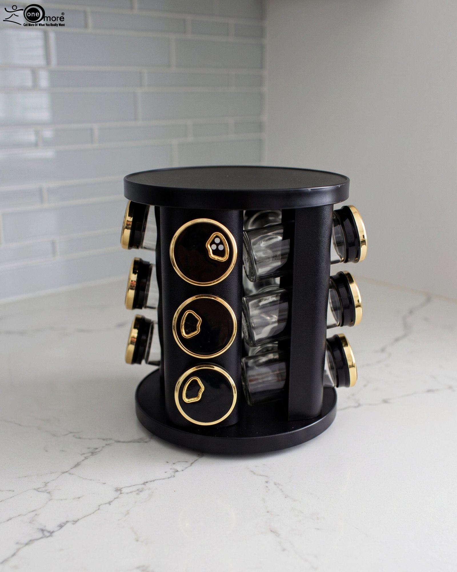 1 Modern 12-piece rotating black and gold spice rack organizer with glass jars on a white marble kitchen countertop