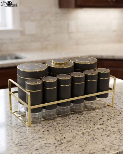 9-piece matte black and gold luxury spice rack set with clear glass bottoms on a granite countertop.