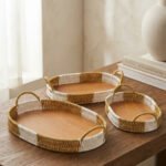 3 piece oval rattan serving trays with handles and wooden bottoms in a two-tone white and natural brown pattern