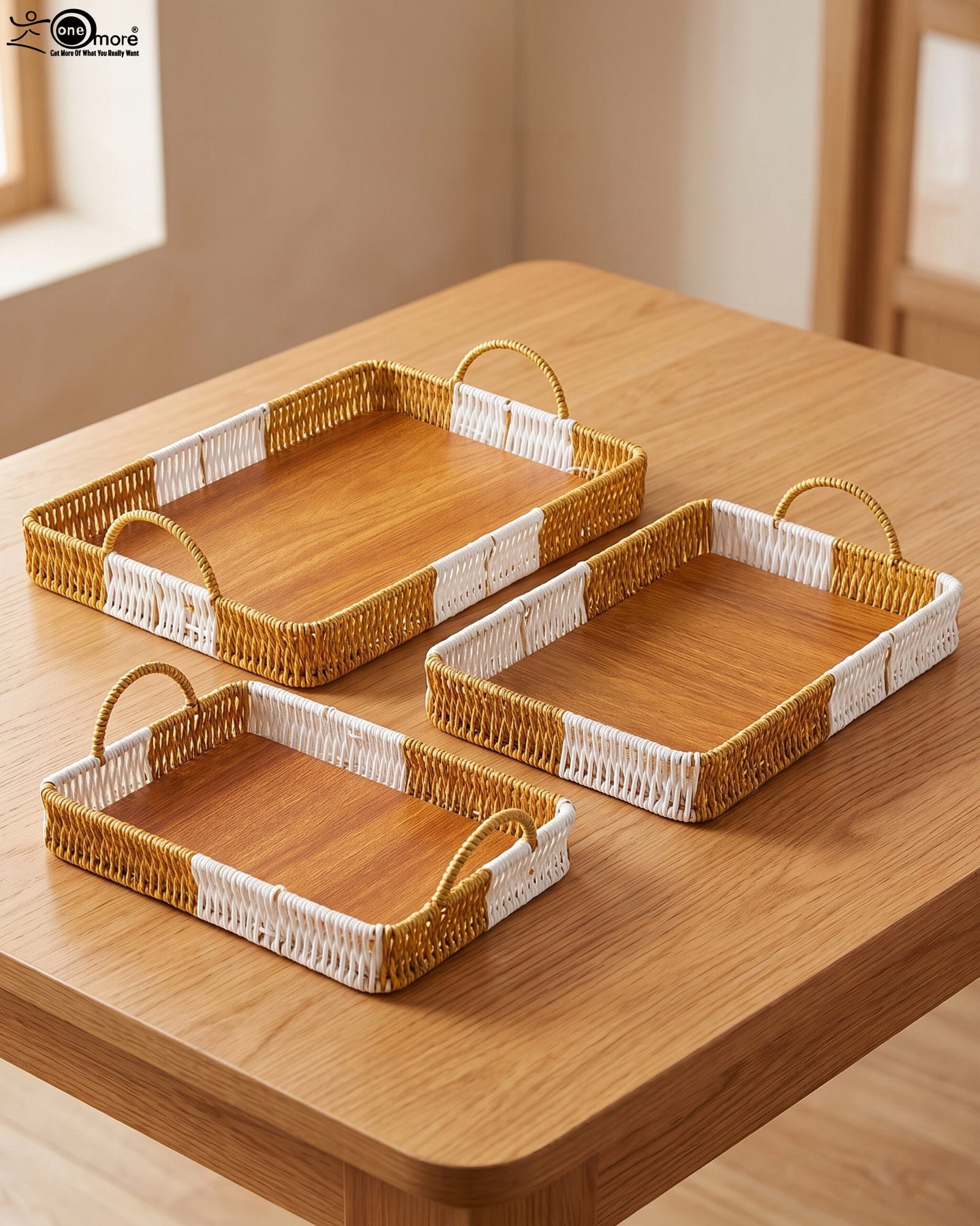1 Set of three rectangular handwoven rattan serving trays with wooden bases and handles on a wooden table.