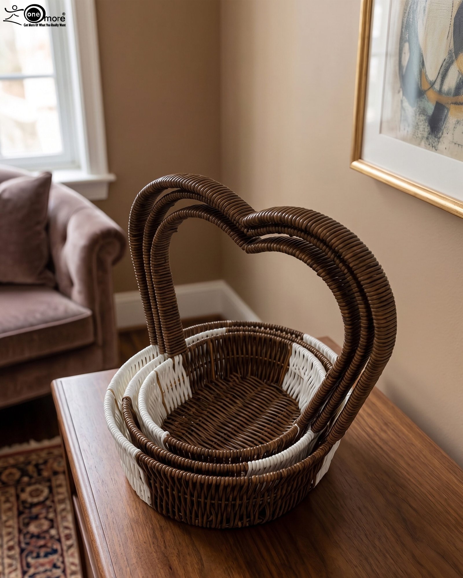 1 Nested set of three brown and white handwoven rattan trays featuring tall heart-shaped handles on a wooden table
