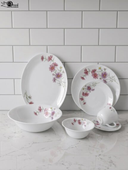 32-piece white printed dinner set with pink floral blossom design displayed on a white marble countertop