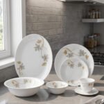 Printed 32 piece white marble ceramic dinnerware set featuring elegant floral patterns displayed on a kitchen counter