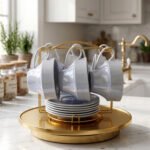 Luxury ceramic tea set with 6 cups, 6 saucers, and a golden stand on a kitchen counter