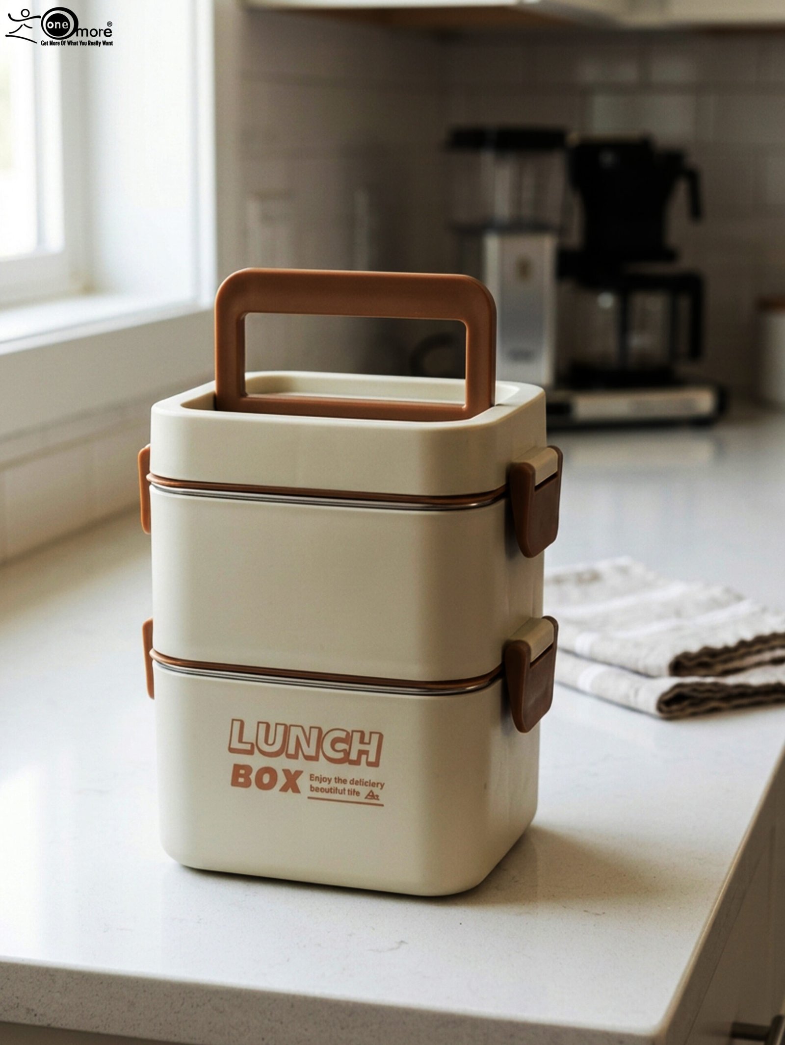 1 Cream and brown 2-in-1 double-layer portable lunch box with handle sitting on a kitchen counter