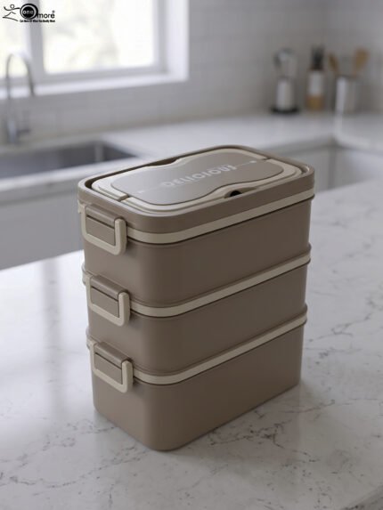 3-in-1 multi-tier beige and brown lunch box stacked on a kitchen countertop