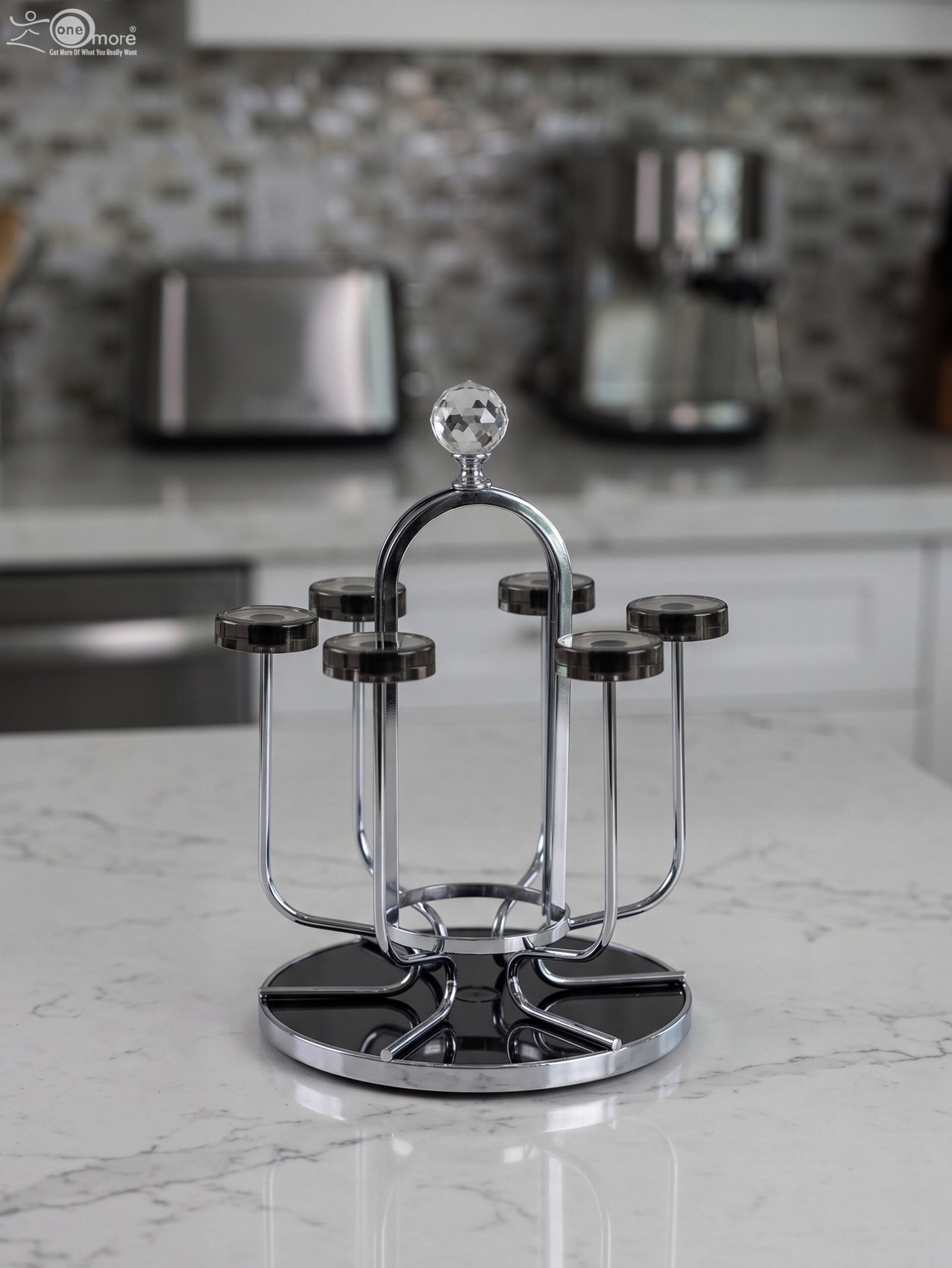 1 Modern silver chrome glass stand with crystal top finial holding six inverted glasses on a kitchen countertop.