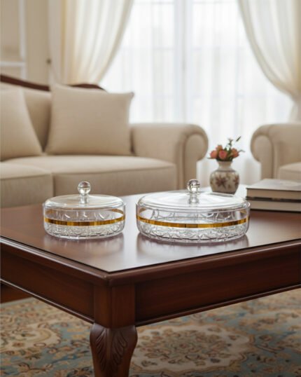 Three elegant cut-crystal dry fruit dishes with gold rims and matching spherical-handle lids displayed in Small, Medium, and Large sizes on a wooden coffee table in a modern living room.