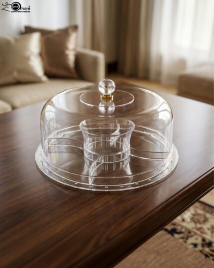 Clear acrylic dry fruit and cake serving platter with multi-compartments, center bowl, and a crystal knob dome lid resting on a wooden table.