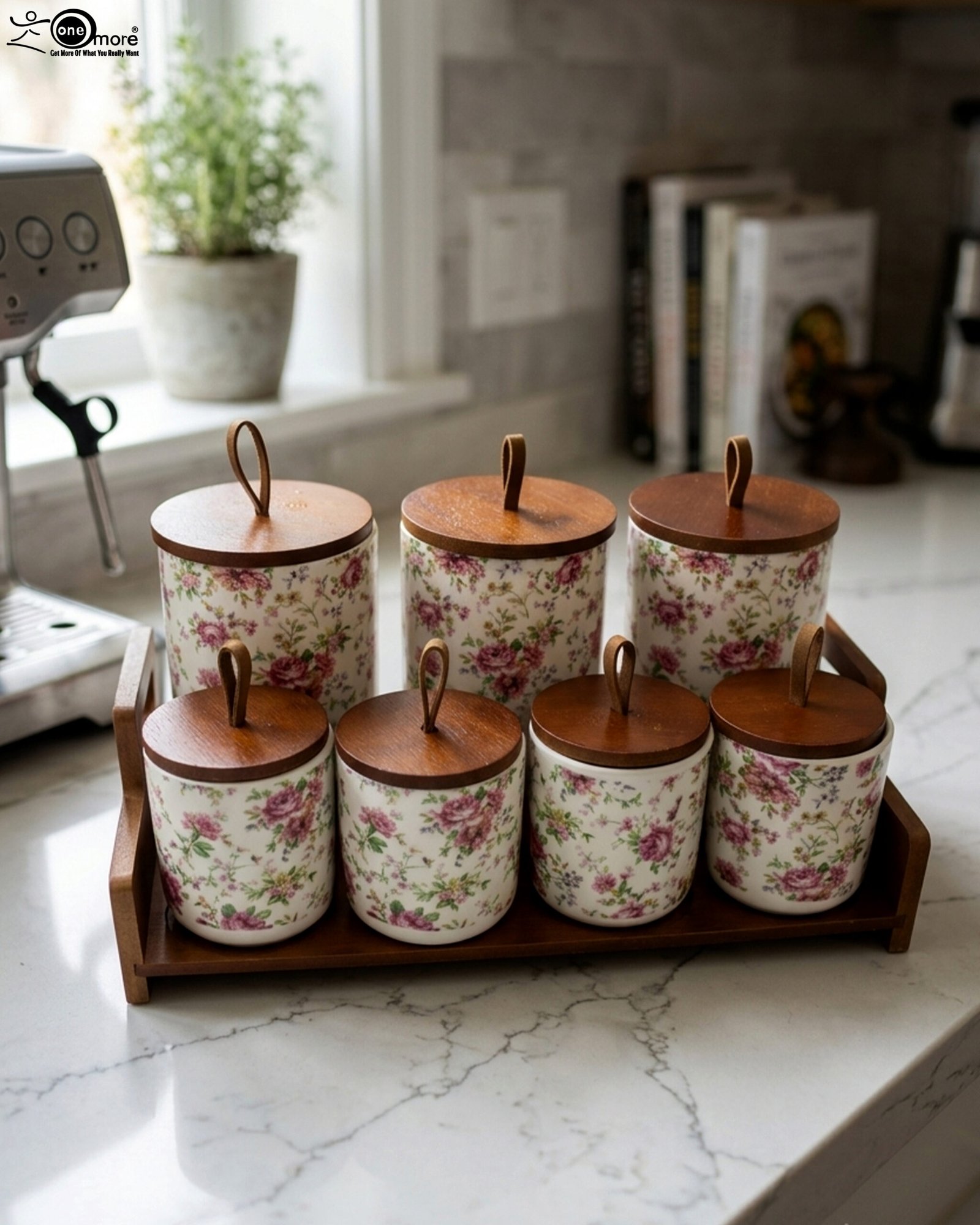 1 Floral ceramic kitchen canister and jar set with wooden lids and display stand on a kitchen counter