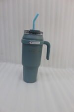 A row of colorful 1.5L stainless steel tumblers with handles and straws arranged on a kitchen counter.