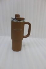 A collection of 900ml insulated "Nice Time Sitarayuri Coffee" tumblers with handles displayed in various colors on a kitchen counter.