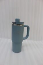 A collection of 900ml insulated "Nice Time Sitarayuri Coffee" tumblers with handles displayed in various colors on a kitchen counter.