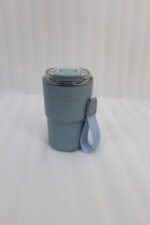 Line-up of colorful 360ml stainless steel travel tumblers with matching carrying straps and clear lids displayed on a kitchen counter.