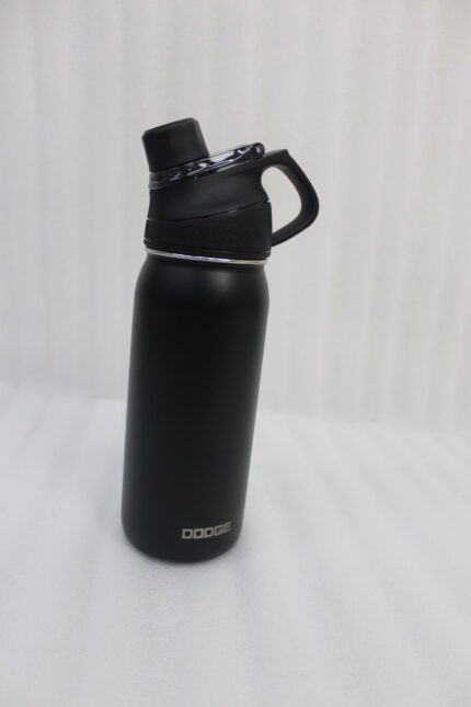 Four Dodge 630mL stainless steel water bottles in black, sage green, grey, and beige lined up on a kitchen counter.