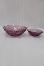 7-piece grey glass fruit set featuring one large serving bowl and six matching small bowls with gold rims, displayed on a kitchen countertop.