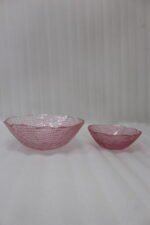 7-piece grey glass fruit set featuring one large serving bowl and six matching small bowls with gold rims, displayed on a kitchen countertop.